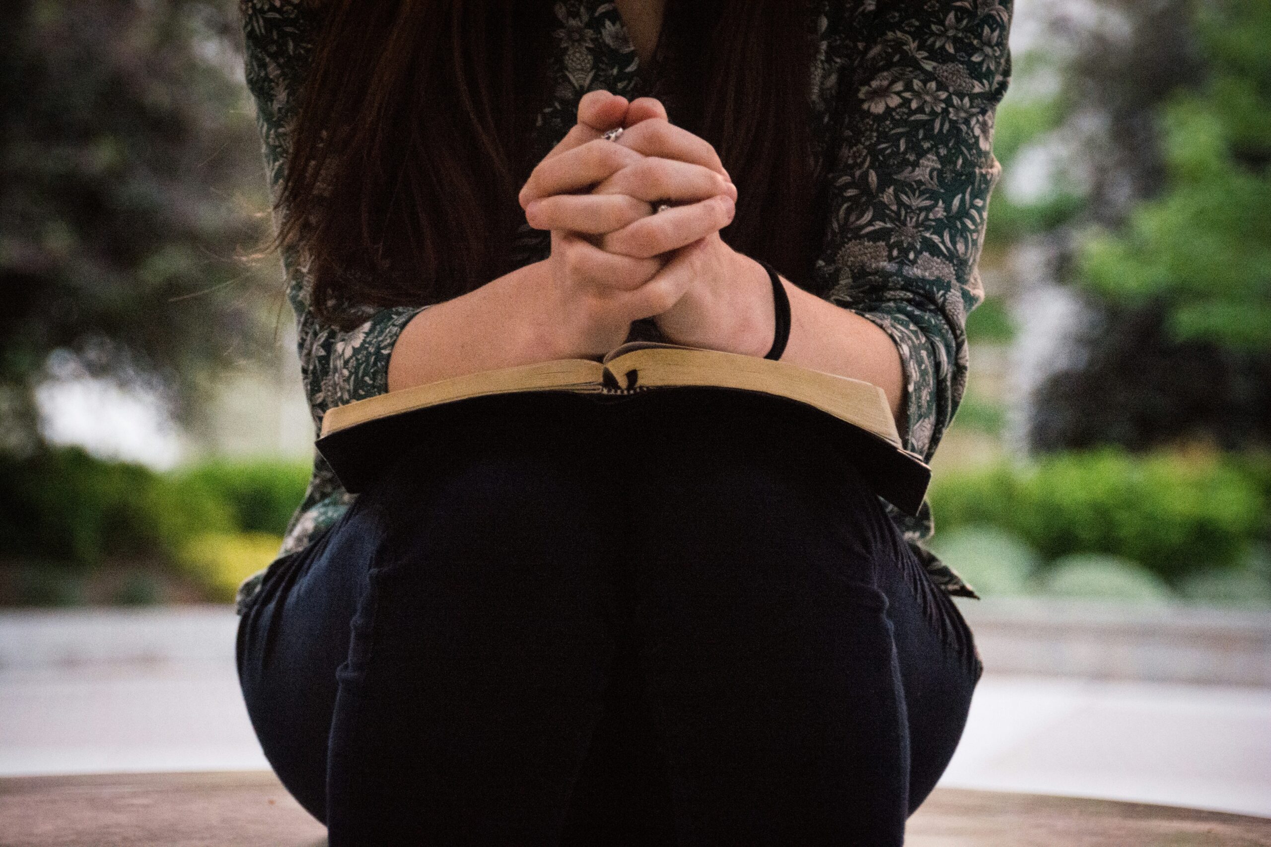woman praying Bible